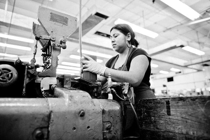 Quality-focused worker at precision station